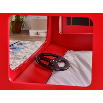 Red playpen with a black wheel inside, showing a room with toys and furniture in the reflection.