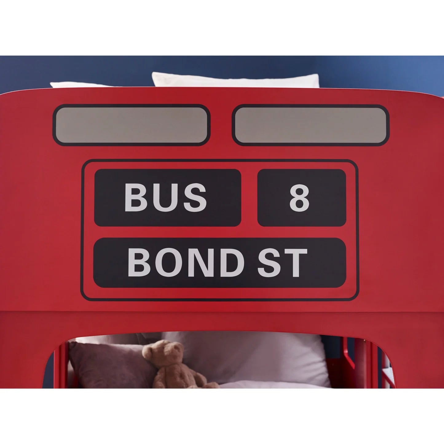Red bus-shaped bed with 'Bus 8 Bond St' sign on a blue background