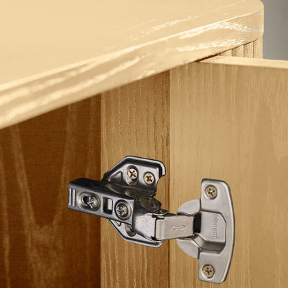 Close-up of a cabinet hinge on wooden furniture