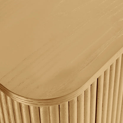 Close-up of a wooden surface with a curved edge and vertical slats.