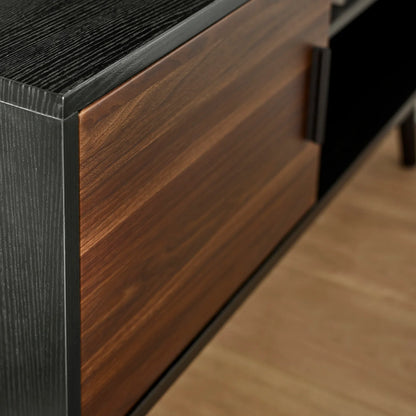 Close-up of a wooden drawer with a dark finish on a wooden floor.